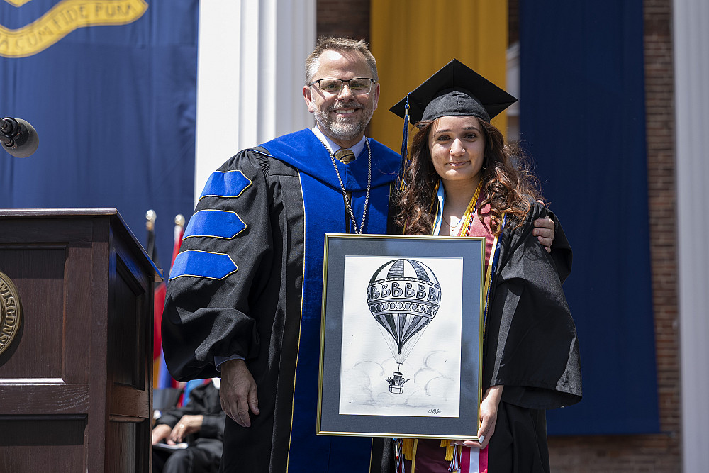 Franccesca Mamani'24 receiving the Warren Miller Blue Skies Award.