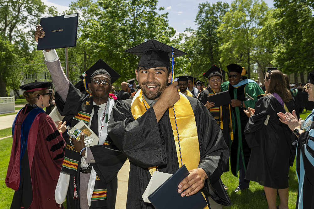 Jose Elias Guillen II'24 walks past excited crowds after the ceremony.