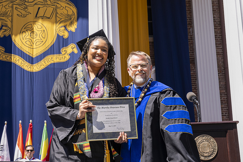 Jasmin Anna Bowers '25 receiving the Martha Peterson Prize at Beloit College's 2025 Commencement ceremony.