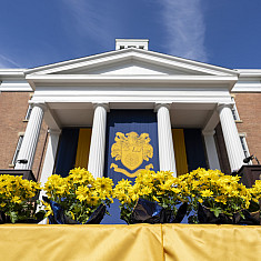 The stage, dressed with mums, awaiting the commencement ceremony to start.