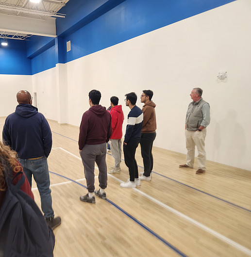 Students, faculty, and staff visit the Madison Recreation pickle ball courts.