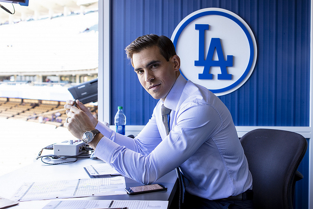Joe Davis'10 prepares to announce a night game in the Dodger Stadium broadcasting booth.