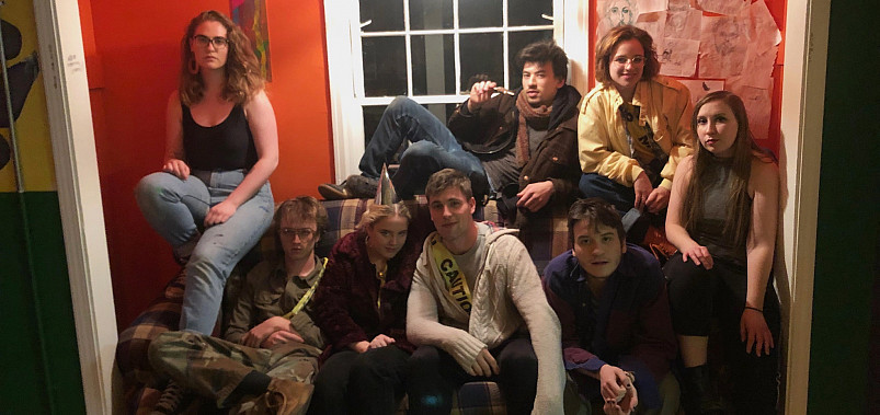 Members of the 2019 C-Haus reopening committee pose on a couch.