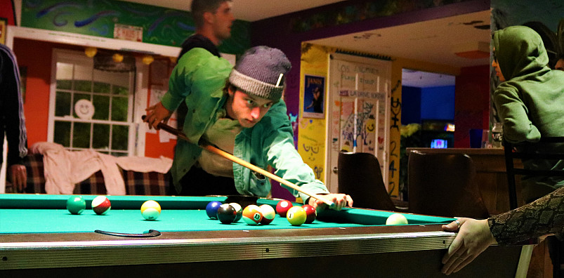 Students playing pool at C-Haus.