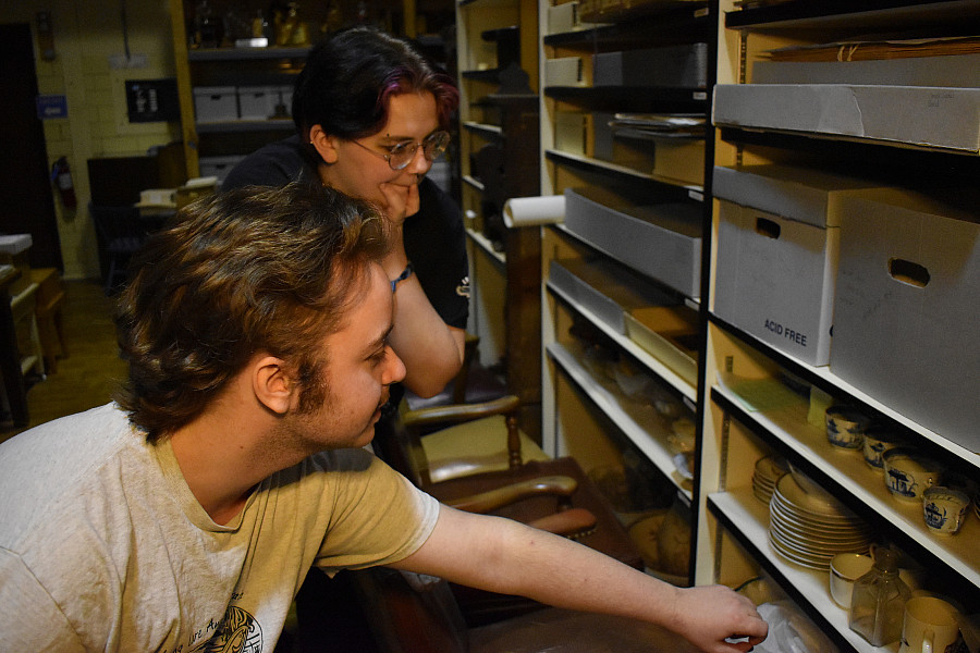 Students examine collections in the Beloit Historical Society
