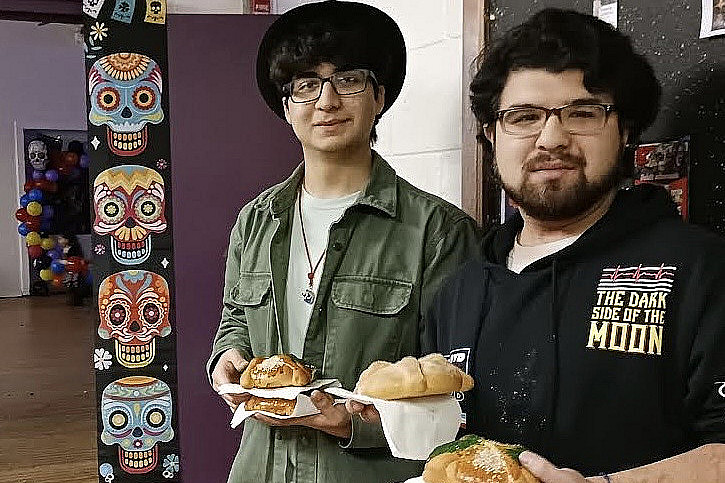 Fernando'27 and Francisco'26 Orbezo enjoying treats at Day of the Dead celebration organized by Hispanos Unidos on Nov. 3, 2023.