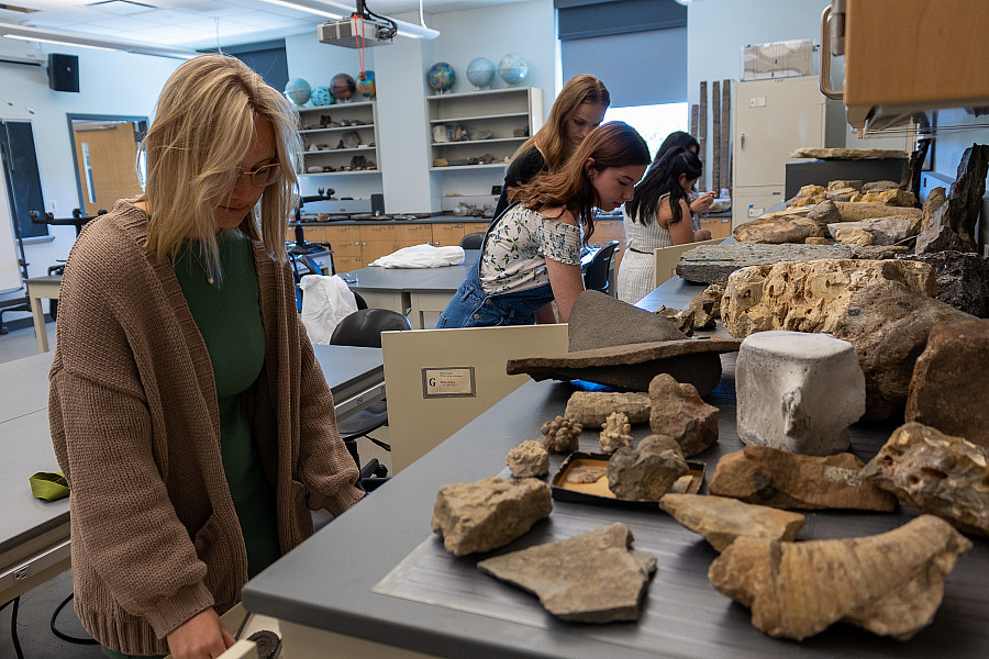 Students looking through geology samples.