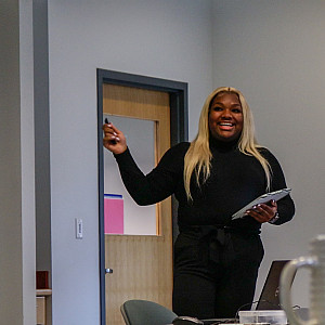 Jada Daniel’23 presents her research on Channels and domestic minority students at the 2023 student symposium.