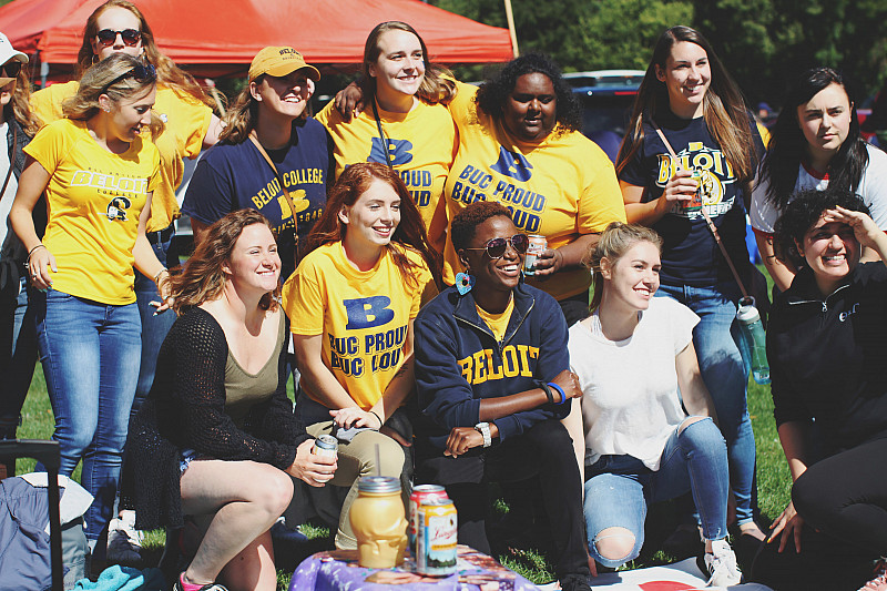Members of Theta Pi Gamma tailgate at the Homecoming football game against Cornell College.
