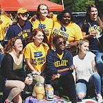 Members of Theta Pi Gamma tailgate at the Homecoming football game against Cornell College.