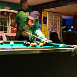 Students playing pool at C-Haus.