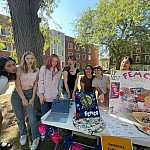Members of Fem Co at Involvement Fair table.