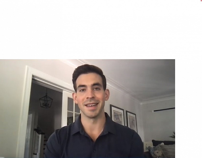 Joe Davis'10 accepting his 2020 Young Alumni Award from his home.