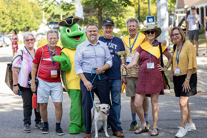 President Boynton with alumni and Torti at the Homecoming parade.