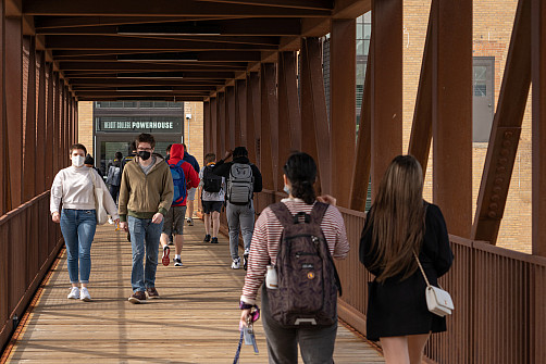 Students walking across the Powerhouse bridge.