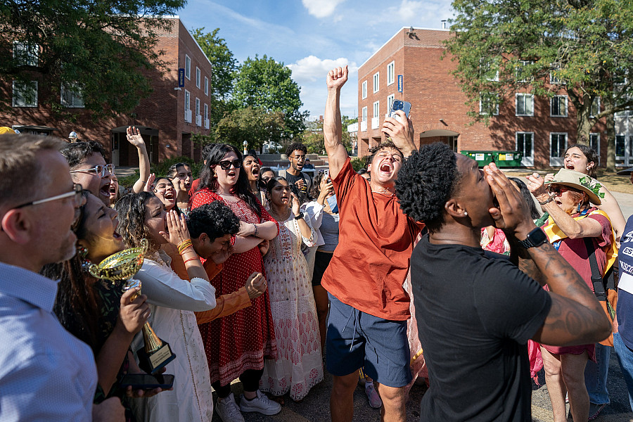 Students cheer the winners of the 2024 Homecoming Parade
