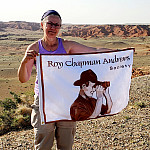 Shannon Fie displays the Roy Chapman Andrews Society flag.