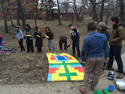 Students install Beloit Path by Lisa Anne Auerbach, who proposed the project as Ferrall Visiting Artist in Residence in 2014.