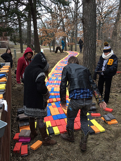 Students install Beloit Path by Lisa Anne Auerbach, who proposed the project as Ferrall Visiting Artist in Residence in 2014.