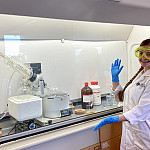 Student poses with laboratory equipment
