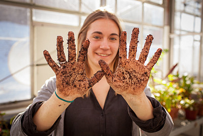 Emma Koeppel working in greenhouse.