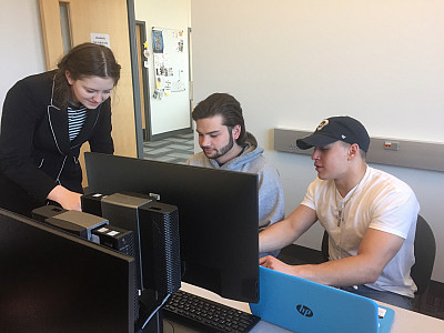 McKensie Finan (left) serving as a Teaching Assistant.