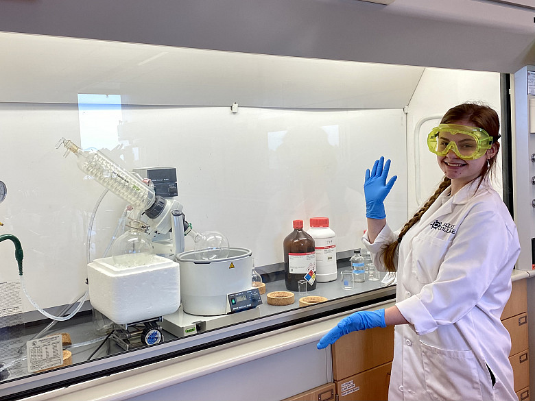 Student poses with laboratory equipment