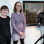 Wright Museum of Art curator Christa Story and chemistry professor Kristin Labby stand next to a painting and an infrared camera