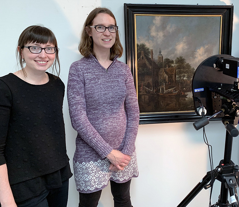 Wright Museum of Art curator Christa Story and chemistry professor Kristin Labby stand next to a painting and an infrared camera