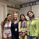 Several Belmark Associates staff members smile for the camera: May Zaw, Julie Fuellman, Helmi Kawsar, and Dhriti Nair