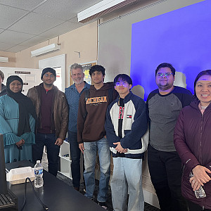 Larry Sullivan with Beloit College faculty members and students