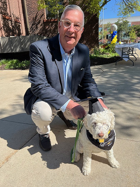 Greg Hanrahan with dog Jessie at Beloit College 2025 Graduation