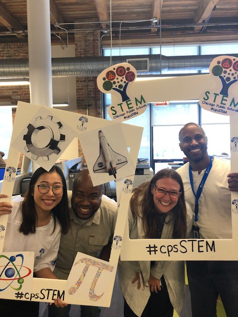 Kate Klein'00 (second person from the right) with her team at Chicago Public School's Department of STEM