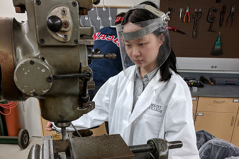 A student works with a milling machine in the Physics Machine Shop in the Science Center.