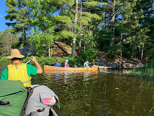 Students canoe to camp.