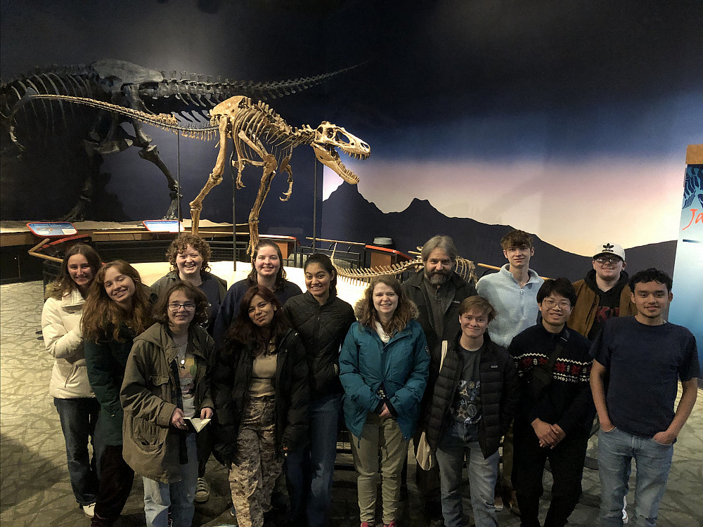 Group photo in front of Jane, the T. rex.