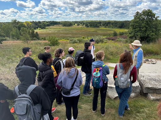 Discussion of kame formation at an overlook; kame in background.