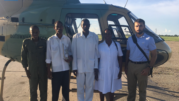 Matias Grande'16, right, contract tracing with the Regional Malaria Team and Botswana Defense Force.