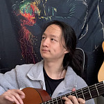 Tianlong “Ethan” Wang’23 playing the guitar