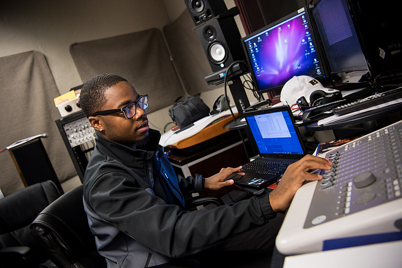 Student working with audio in the recording studio.