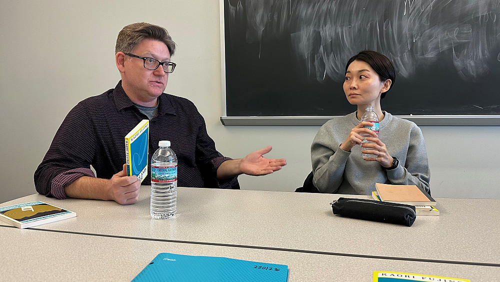 Kendall Heitzman and Kaori Fujino speak with students in the course on contemporary Japanese literature.