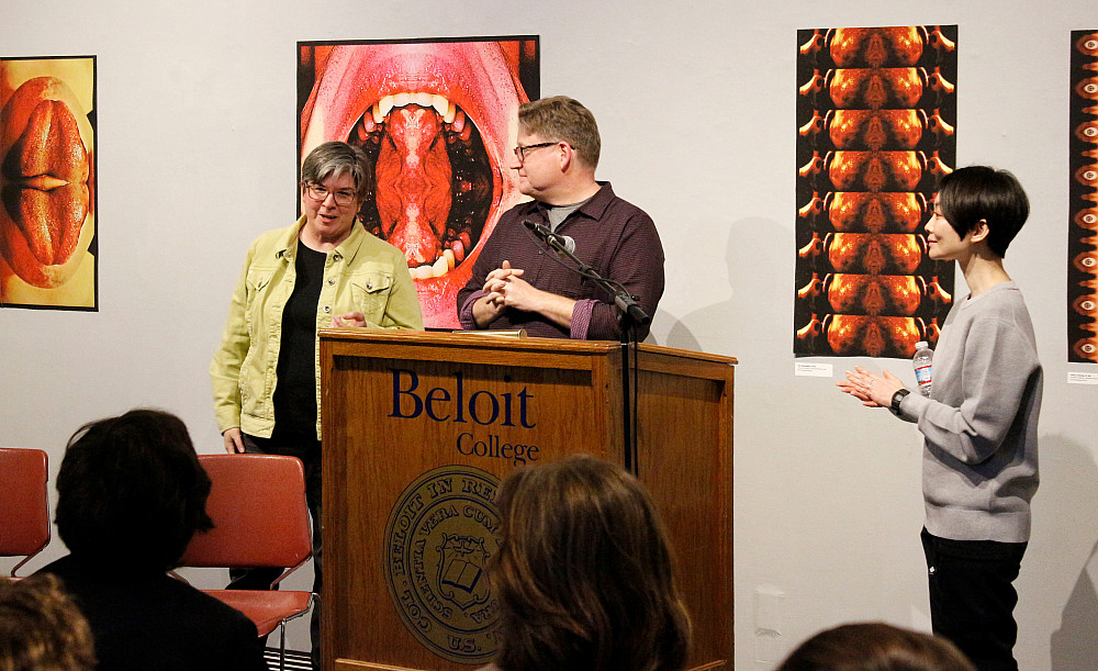 Susan Furukawa speaks to the crowd next to Kendall Heitzman and Kaori Fujino.