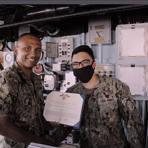 Carlos de Cordoba'11 receiving the Navy Marine Corps Achievement Medal upon completion of his first tour of duty