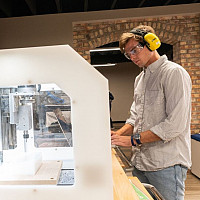 James Wicker'21 using CELEB's CNC machine to prepare for a build