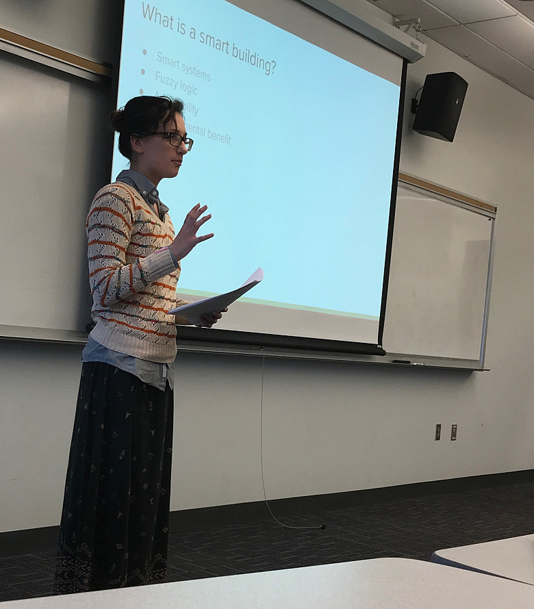 A physics student presents on smart buildings at Spring Symposium Day.