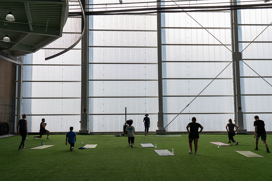 Students taking a workout class for academic credit in the Fieldhouse of the Powerhouse.