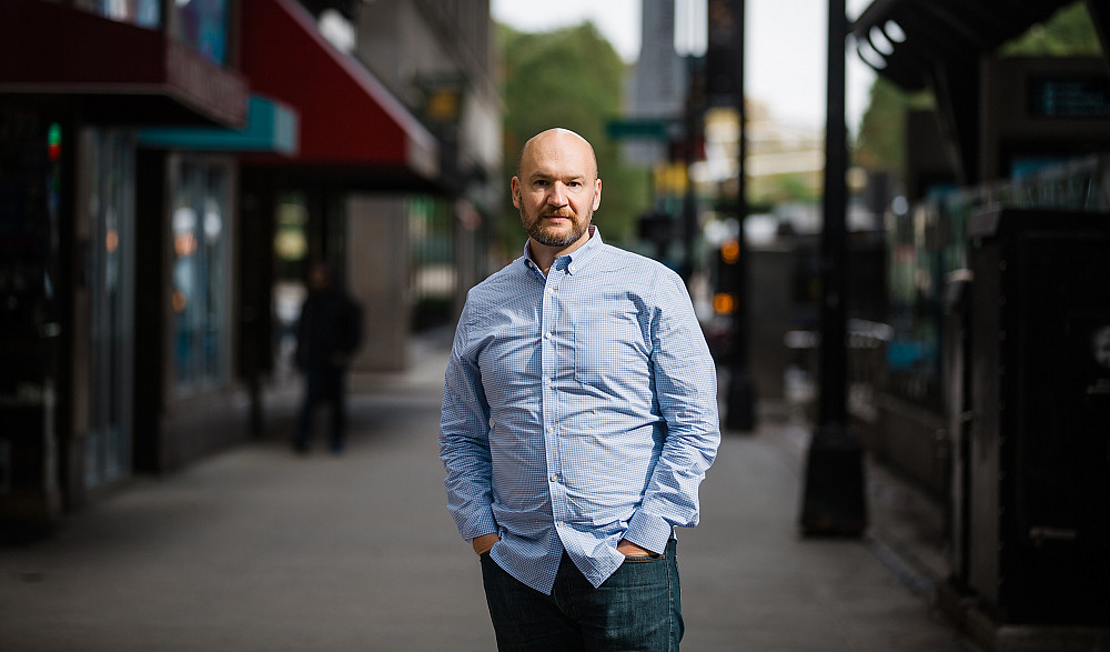 Josh Rosen'95, CEO of 4Front Ventures, standing in downtown Chicago.