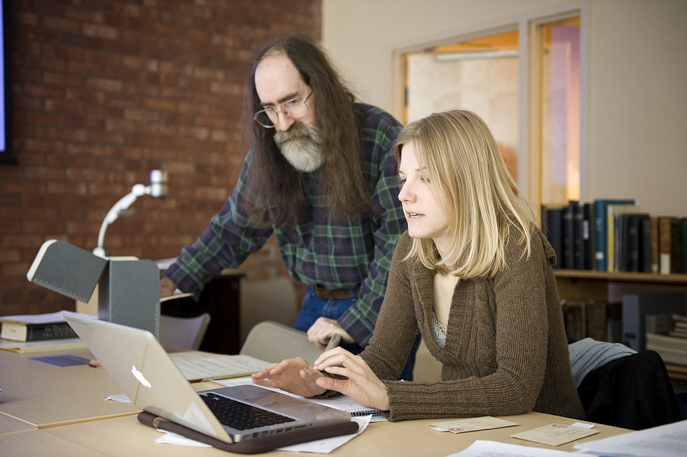 Fred Burwell works with student researcher Allie Moore'10 in the Paula Black Seminar Room adjacent to archives.