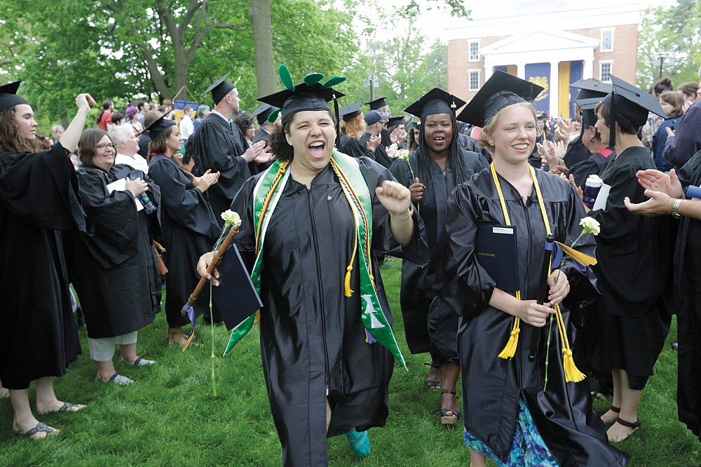 Senior class officer Miranda James'15 gives a joyous shout at the end of the Commencement ceremony.