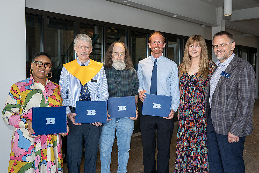 Recipients of 2024 Alumni Awards with President Eric Boynton and wife.
